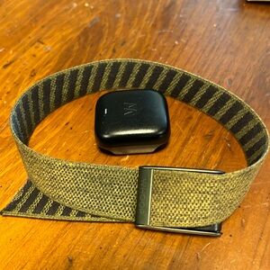 Whoop 4.0 recovery and sleep wearable with bicep/calf band and battery pack.